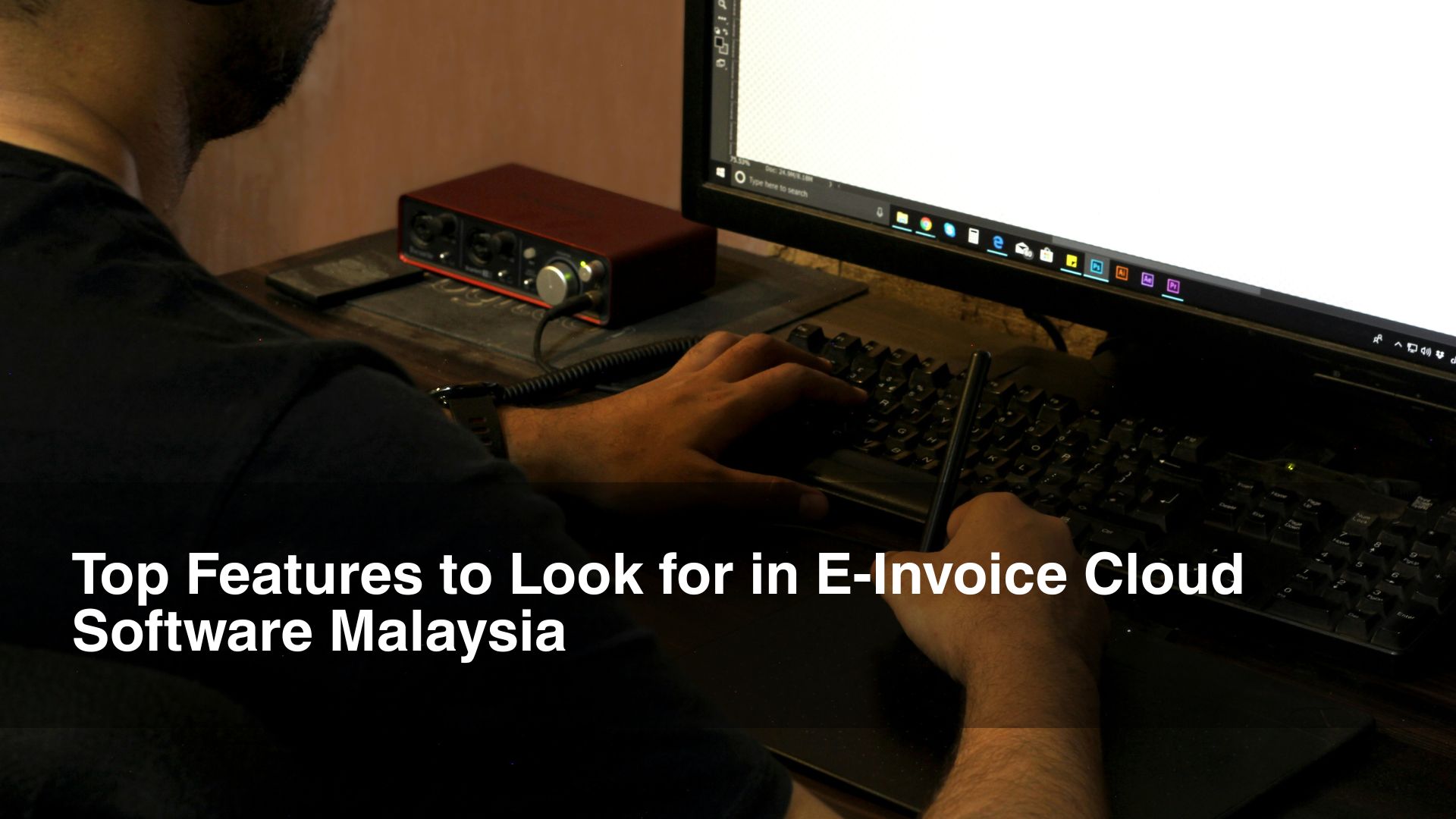 man types on his computer for einvoice
