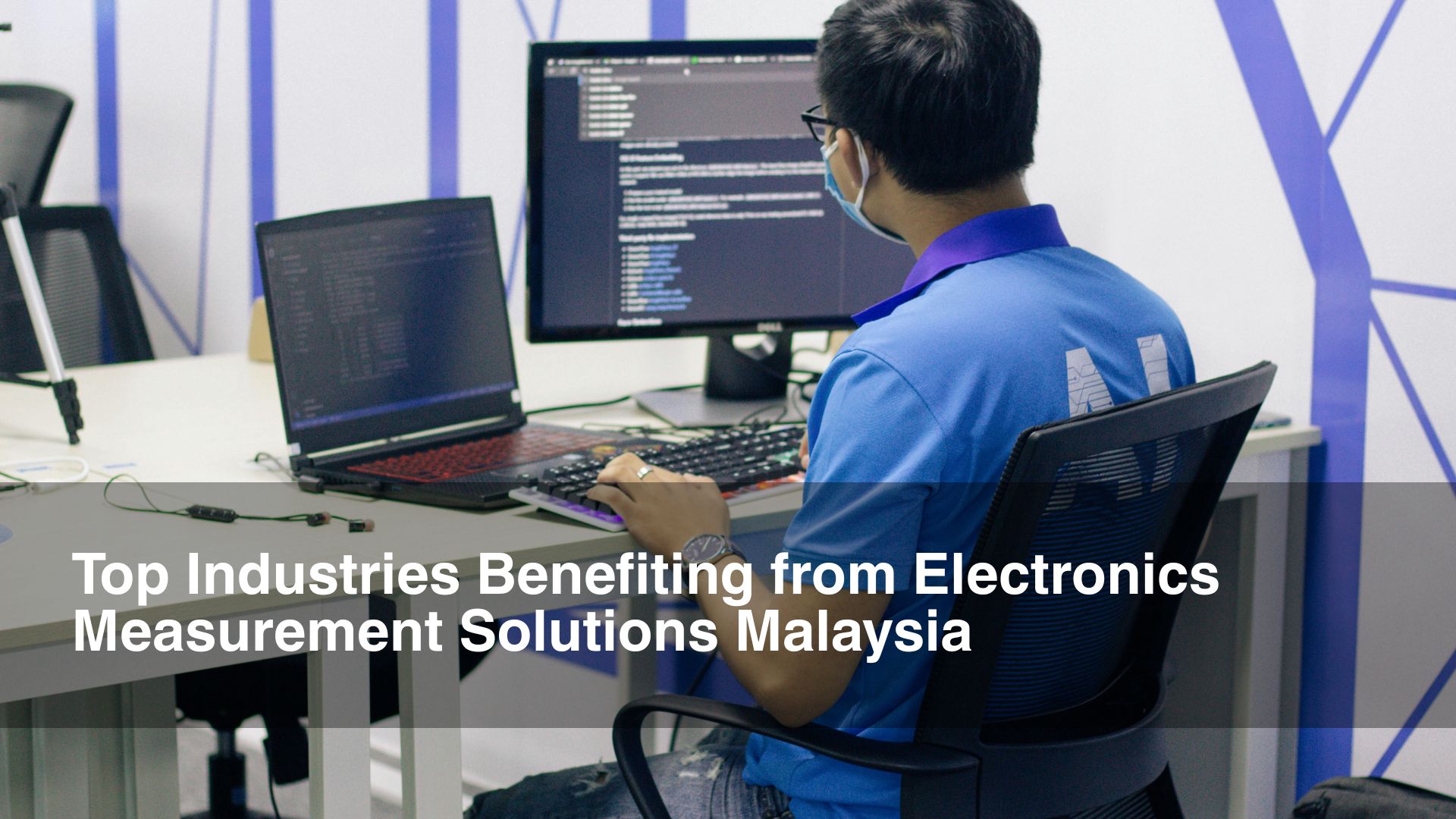 Man in blue shirt performs electronicsmeasurement solutions