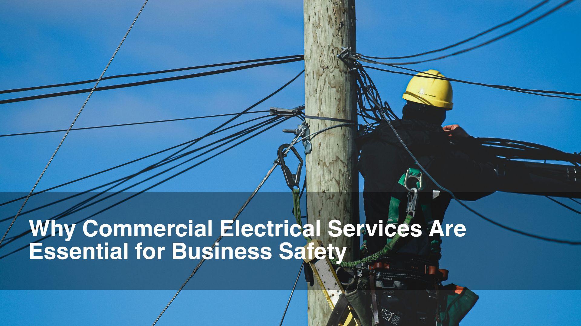 man on tower with yellow hat commercial electrical services